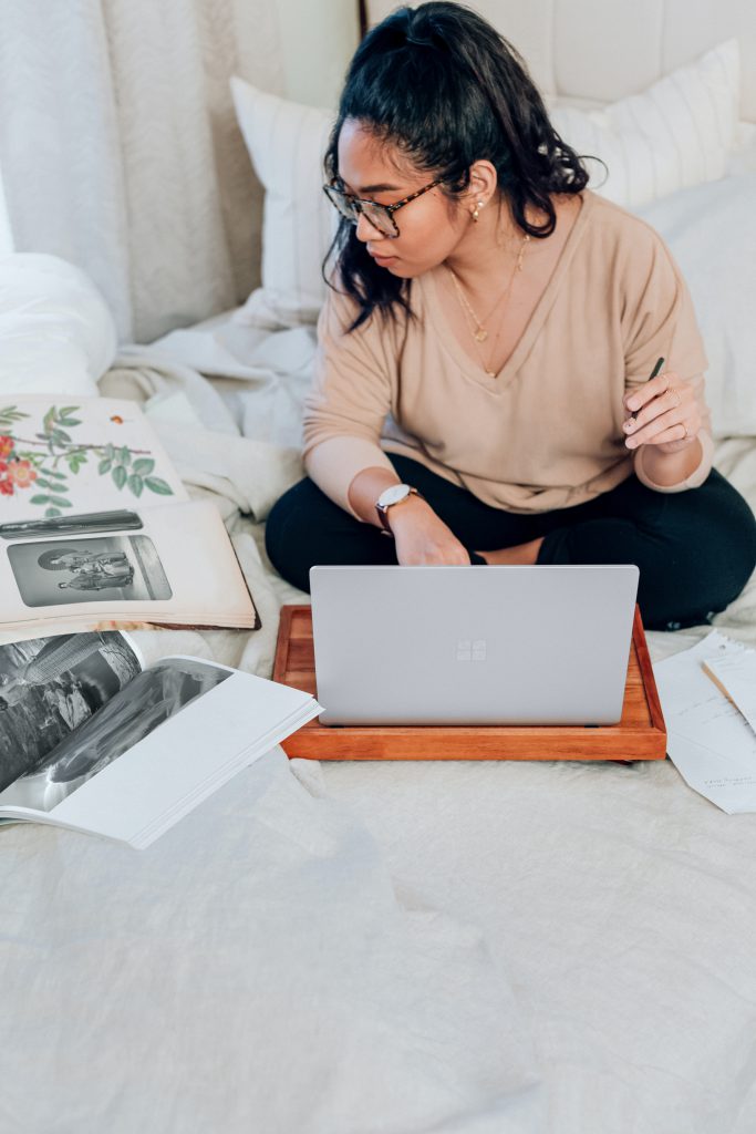 woman in beige long sleeve shirt using microsoft surface in platinum homelike