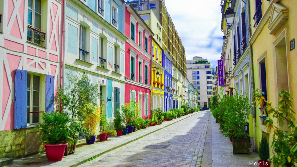 Vibrant street with colorful homes in Paris, a charming area to explore when in Paris