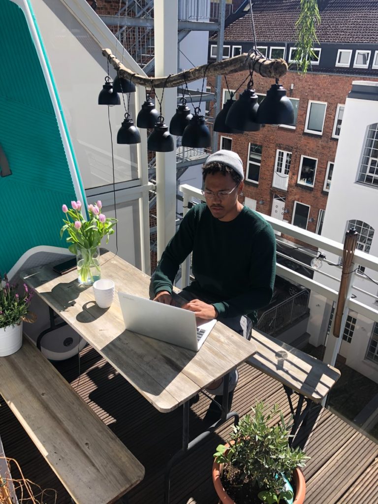 man in black long sleeve shirt sitting on chair