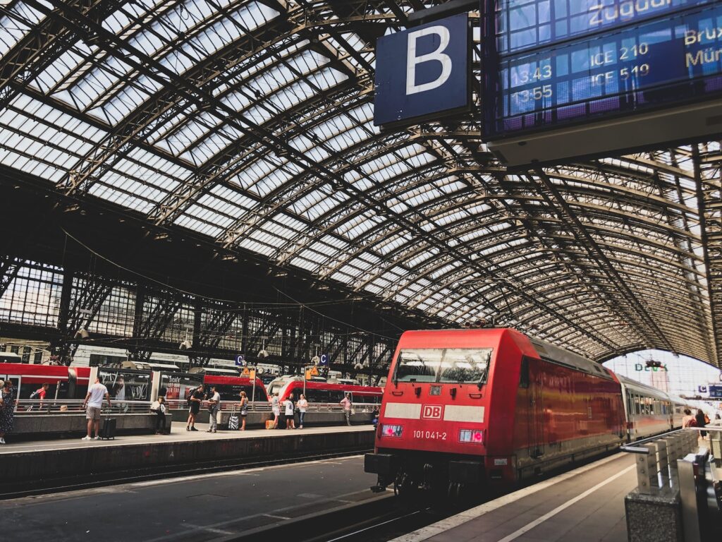 red and white train in a train station